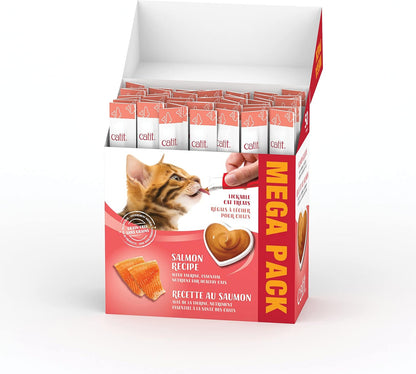 Catit Creamy liquid cat treat tube being hand-fed to a healthy indoor cat