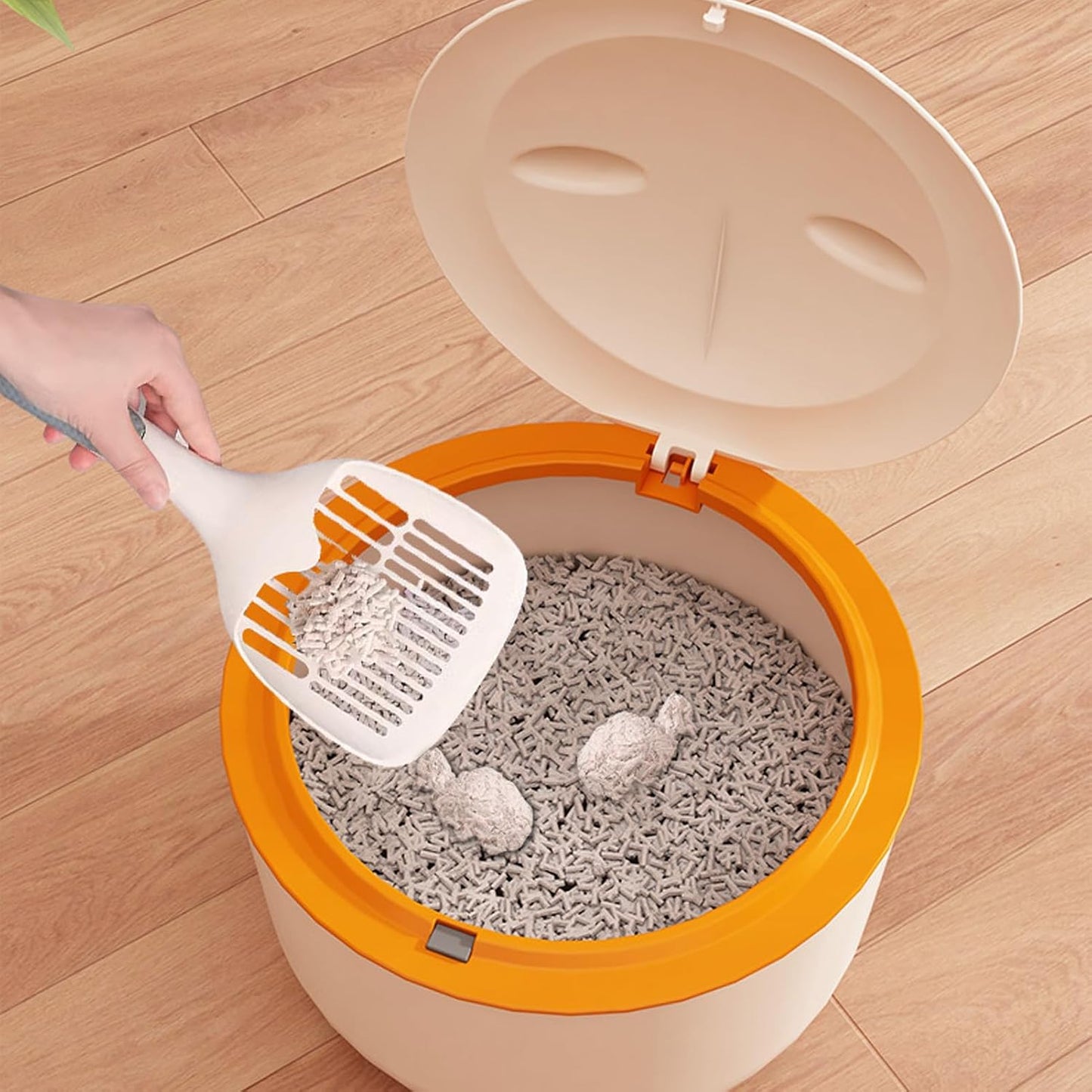 White enclosed cat waste bin on a countertop