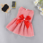 Cute cat wearing the OTKARXUS bowknot pet dress showing comfortable fit and relaxed movement
