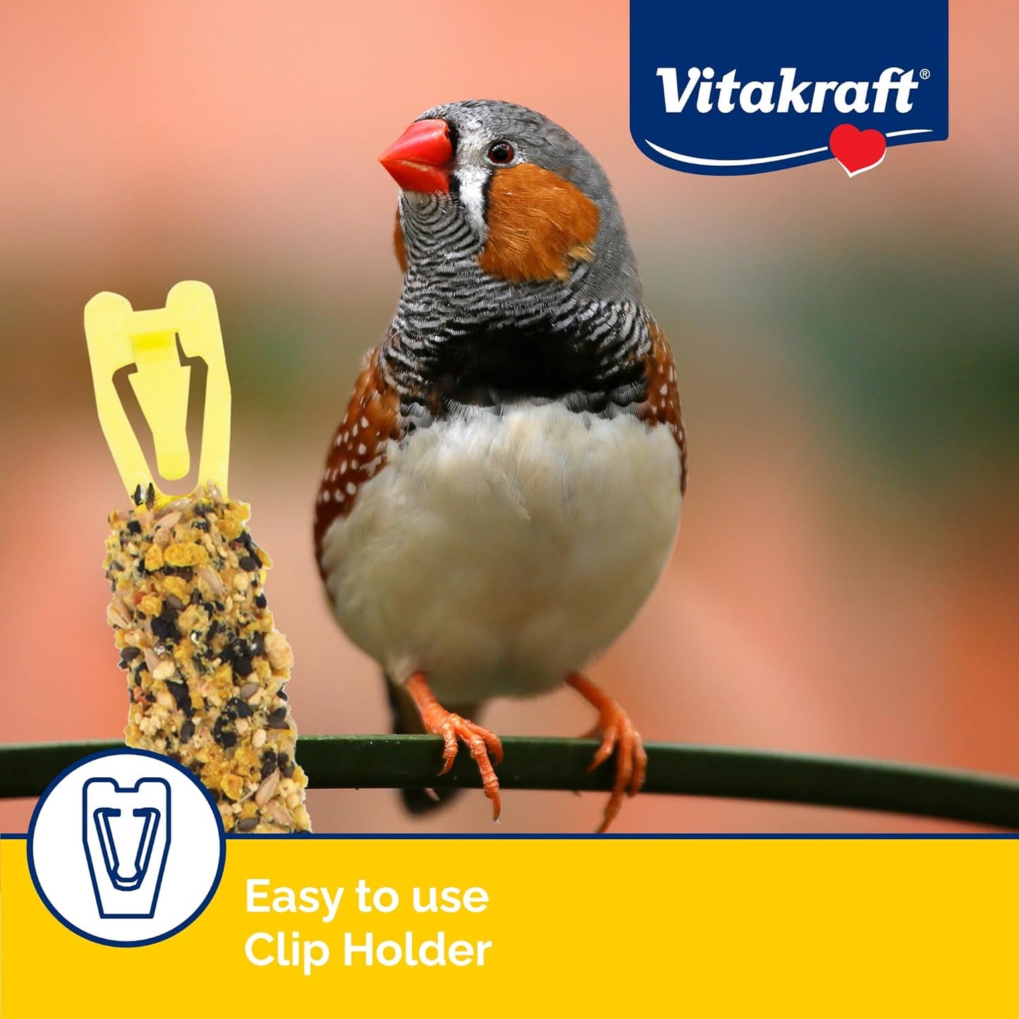 Bird eating Vitakraft crunch stick in cage