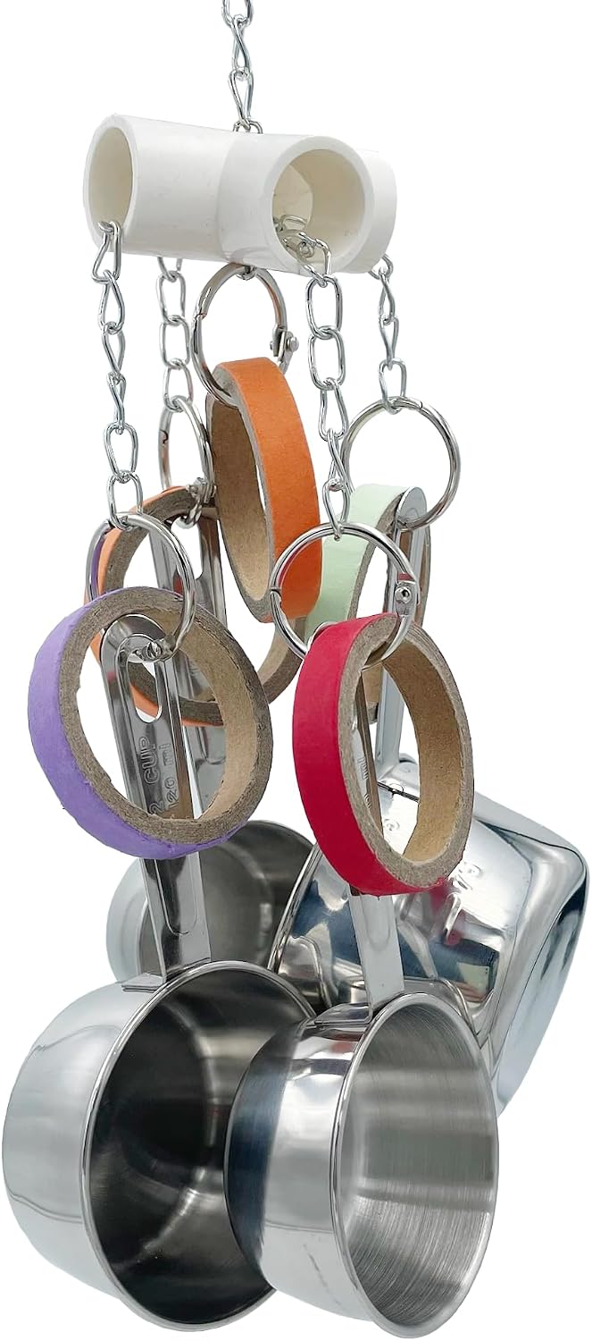 Close up of pullable stainless steel measuring cups on the GILYGI bird toy.