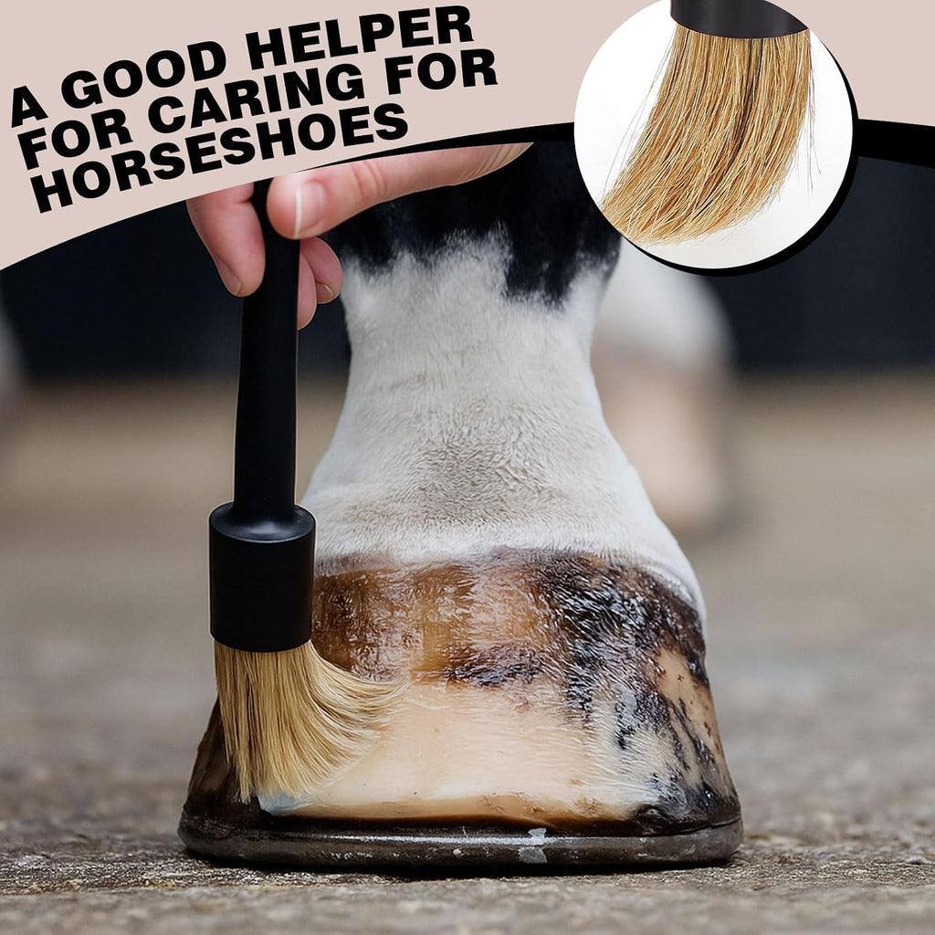 Black plastic horseshoe oil brush showing smooth bristles and hanging hole.