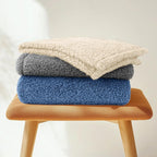 Lightweight washable pet throw blanket being packed for outdoor travel