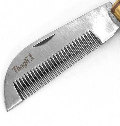 Folded Jeffers pocket horse coat thinning knife showcasing the premium wooden handle and brass bolster.