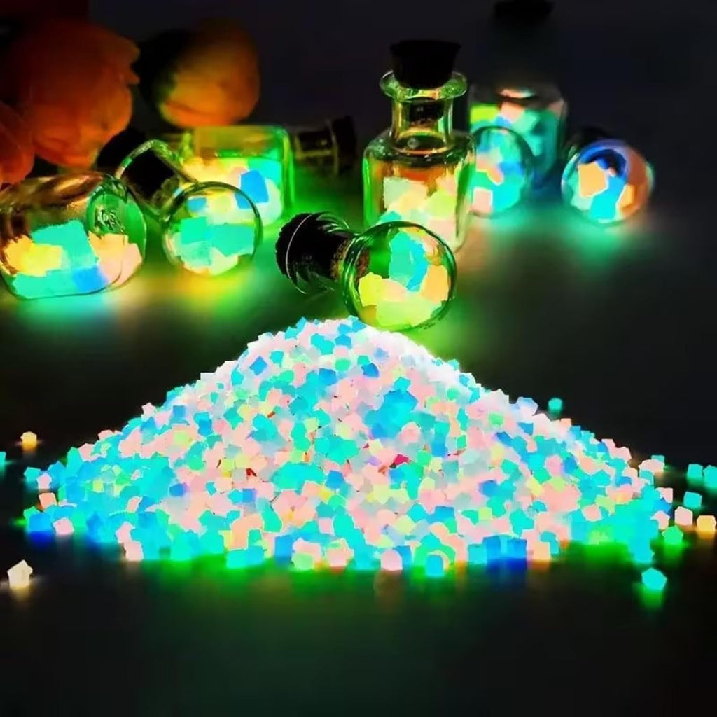 Glowing resin stones in a decorative glass vase