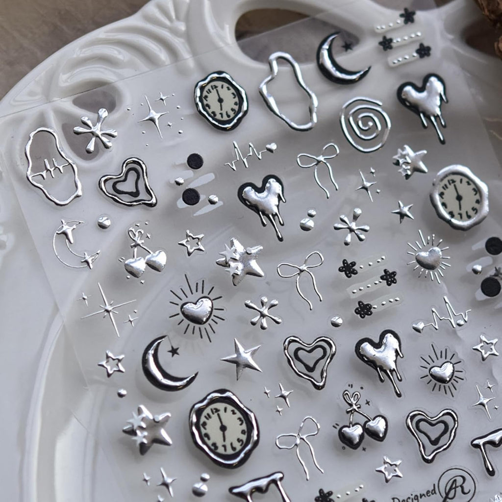 Nbntgh silver nail art stickers front view showing 5D embossed heart and star designs
