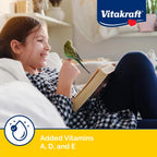 Parakeet eating Vitakraft VitaSmart egg food supplement