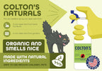 Colton's Naturals cat repellent spray placed in a garden setting