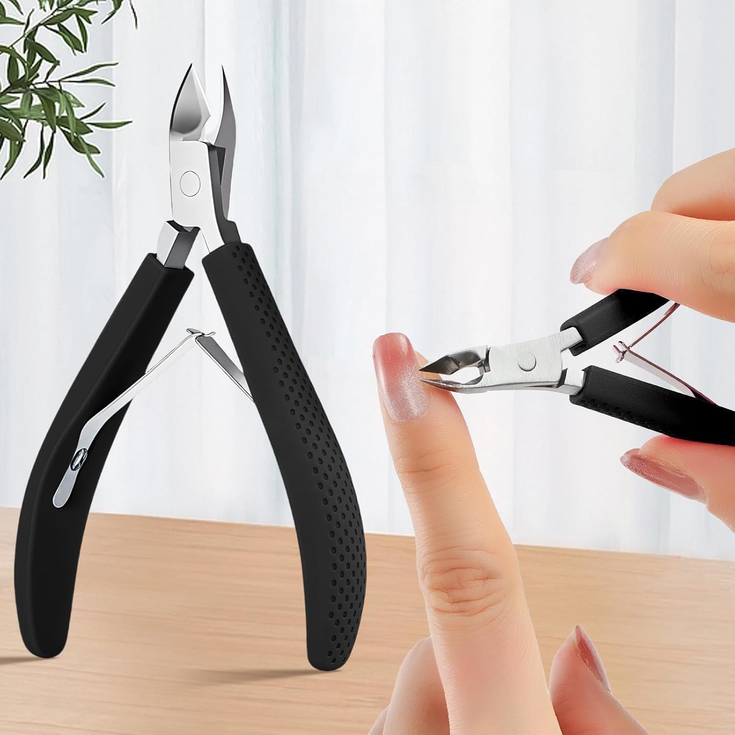 Xuancai black cuticle trimmer nipper front view showing sharp stainless steel blades and non slip silicone handle.