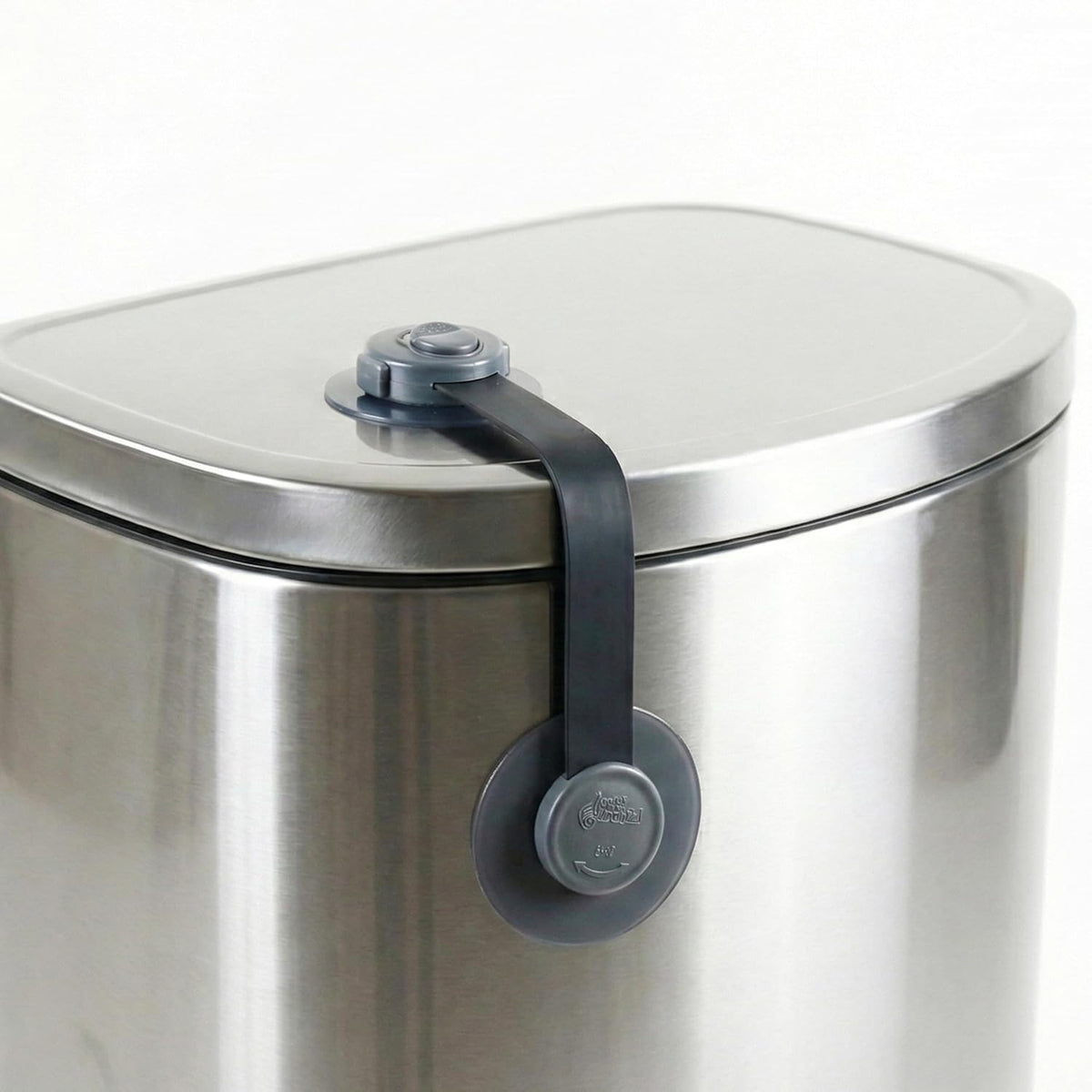 Wappa Baby trash can lock strap front view securing a kitchen garbage bin