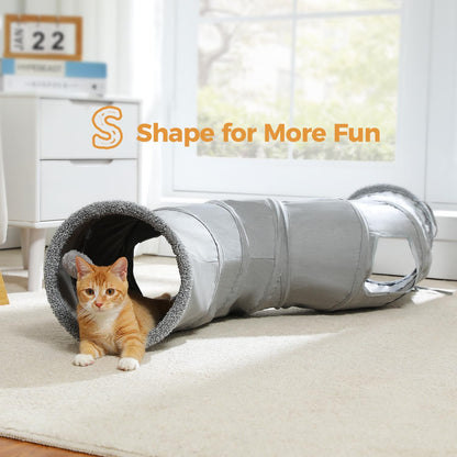 An adult cat peeking out from one of the built-in interactive peek holes.