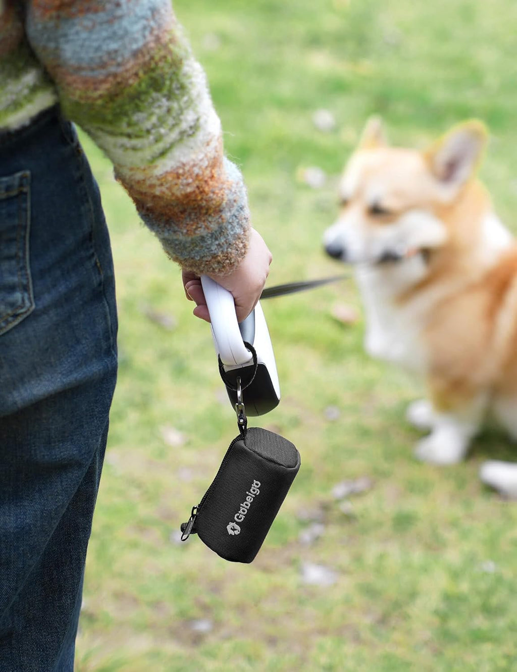 Gobeigo black polyester poop bag dispenser with its included 15 unscented bags and metal carabiner clip