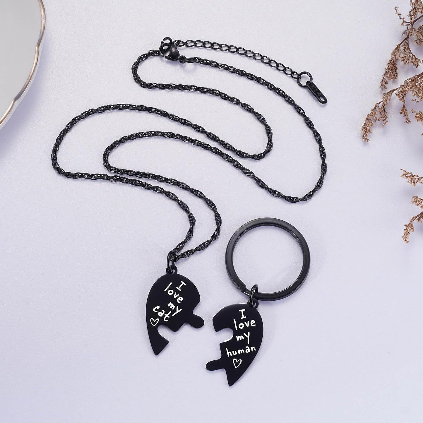 Pet collar charm showing the engraved heart design.