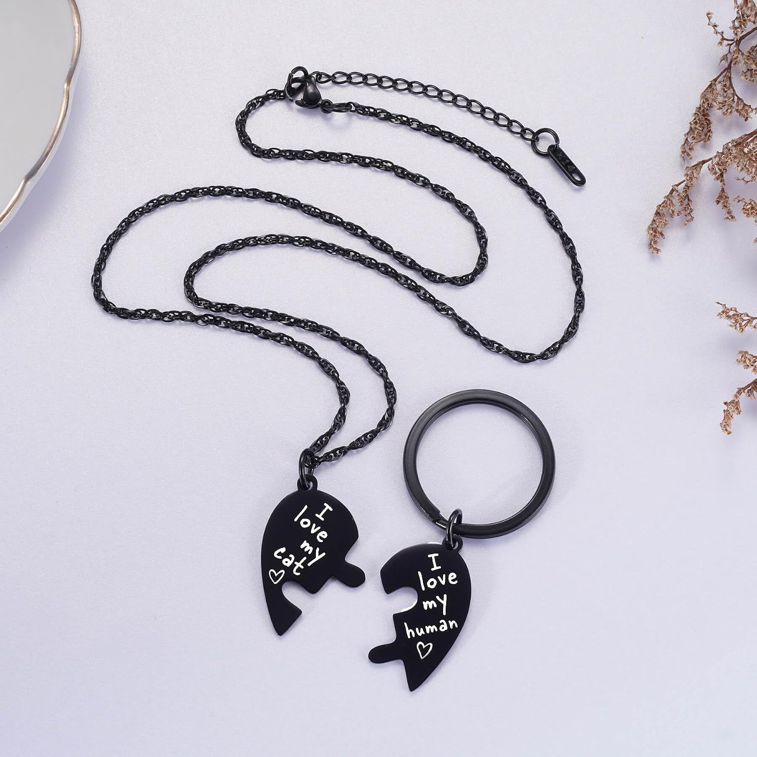 Pet collar charm showing the engraved heart design.