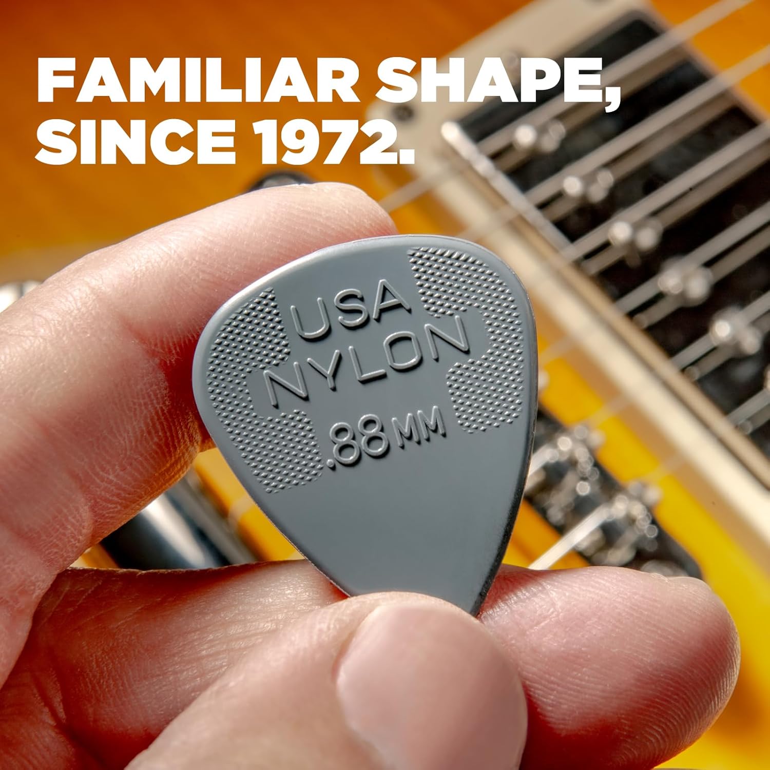 Close up shot of the precision molded rounded edge on the Jim Dunlop thin acoustic guitar pick.