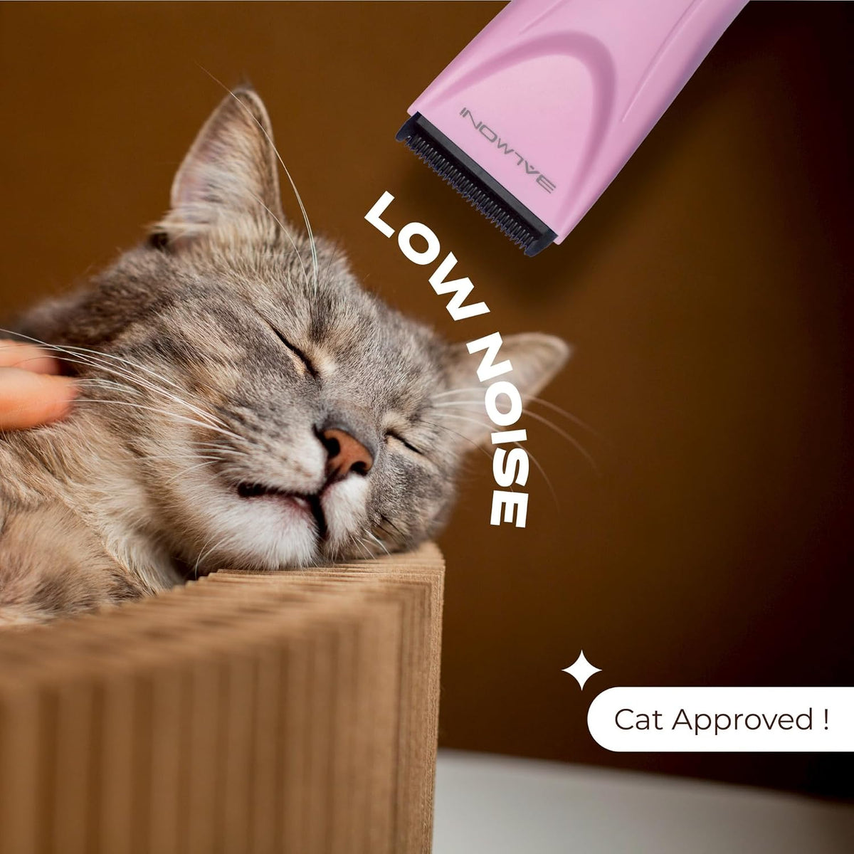 Ergonomic dual speed control buttons on the pink Balmoni cordless pet hair trimmer device.