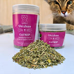 Refillable pet toy being stuffed with premium organic herb