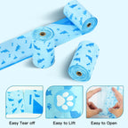 Close up of the thirteen by nine inch large blue dog poop bag showing the cute dog print design.