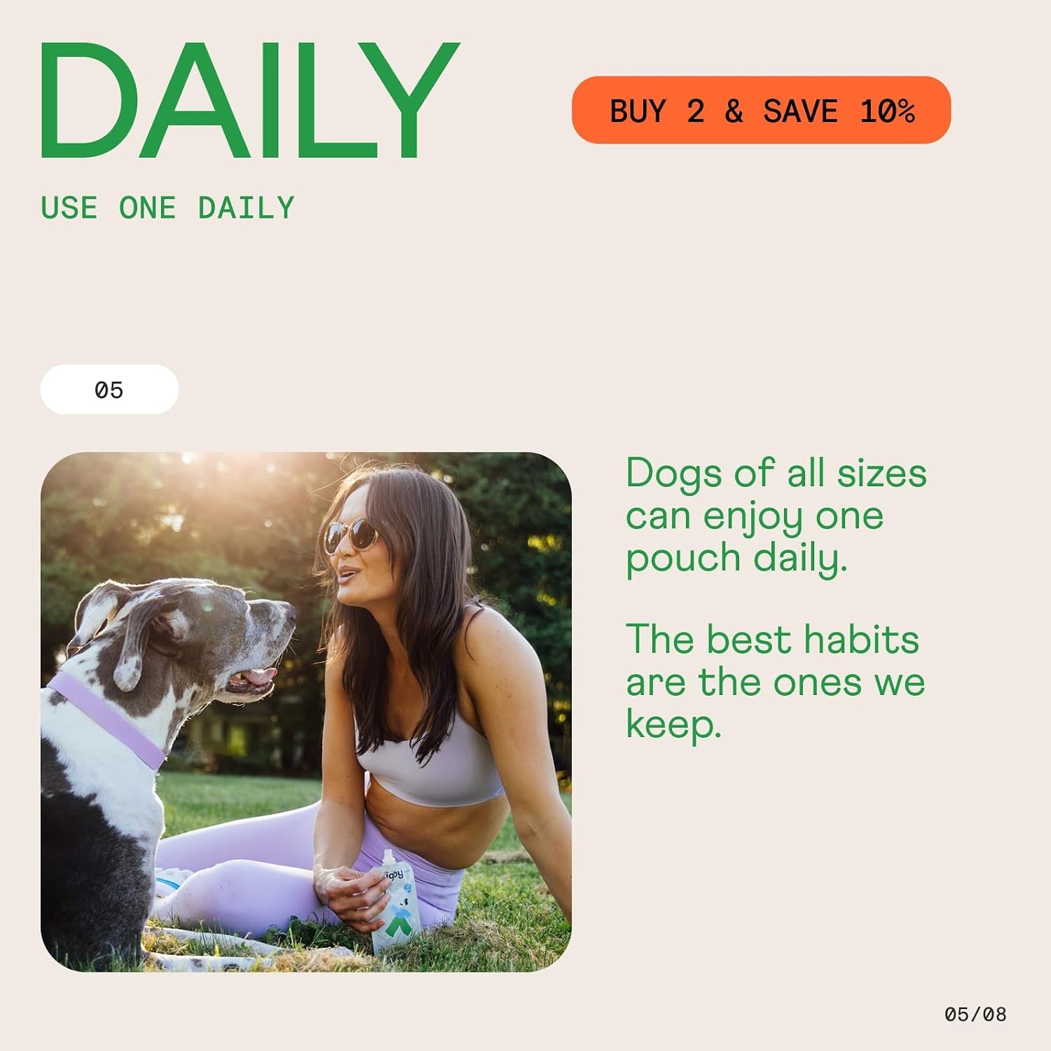 Hand squeezing Rigby organic dog treat onto kibble