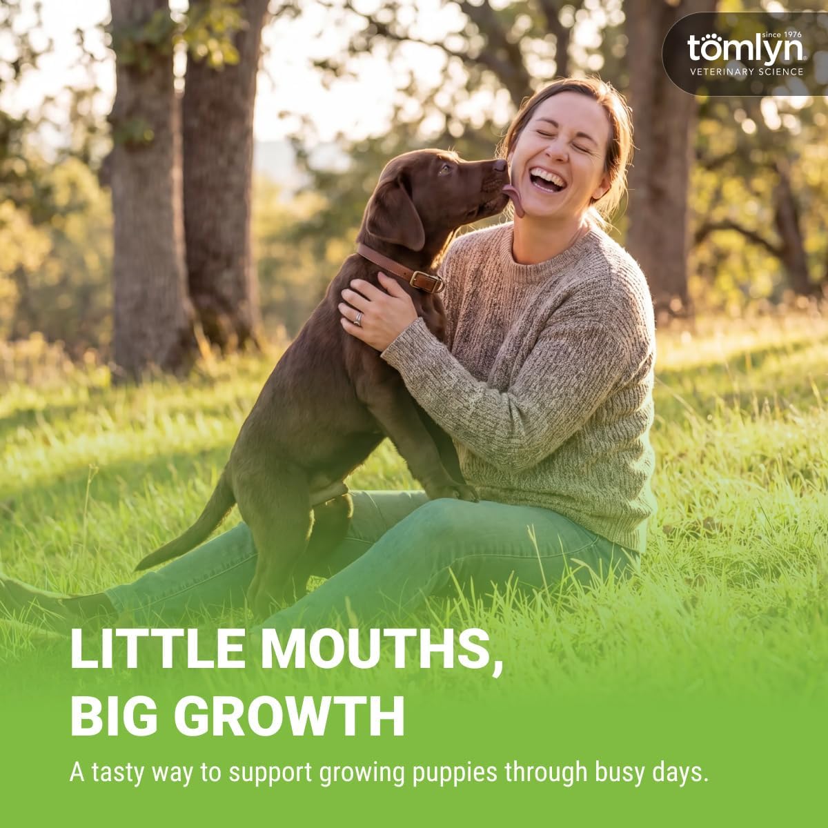 Puppy eating Tomlyn Nutri-Cal gel from a finger