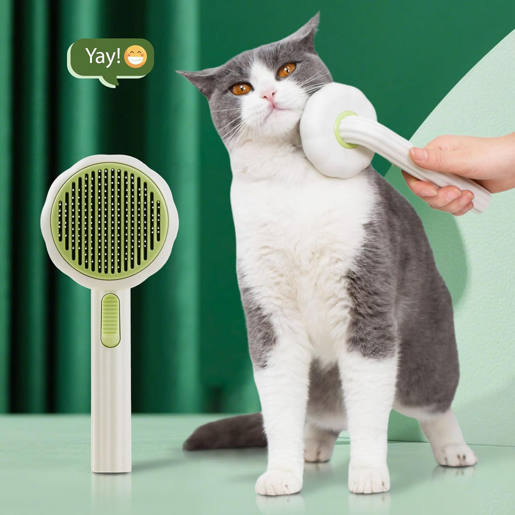VIOJOJO cat brush with release button showing the one click hair removal mechanism in action.