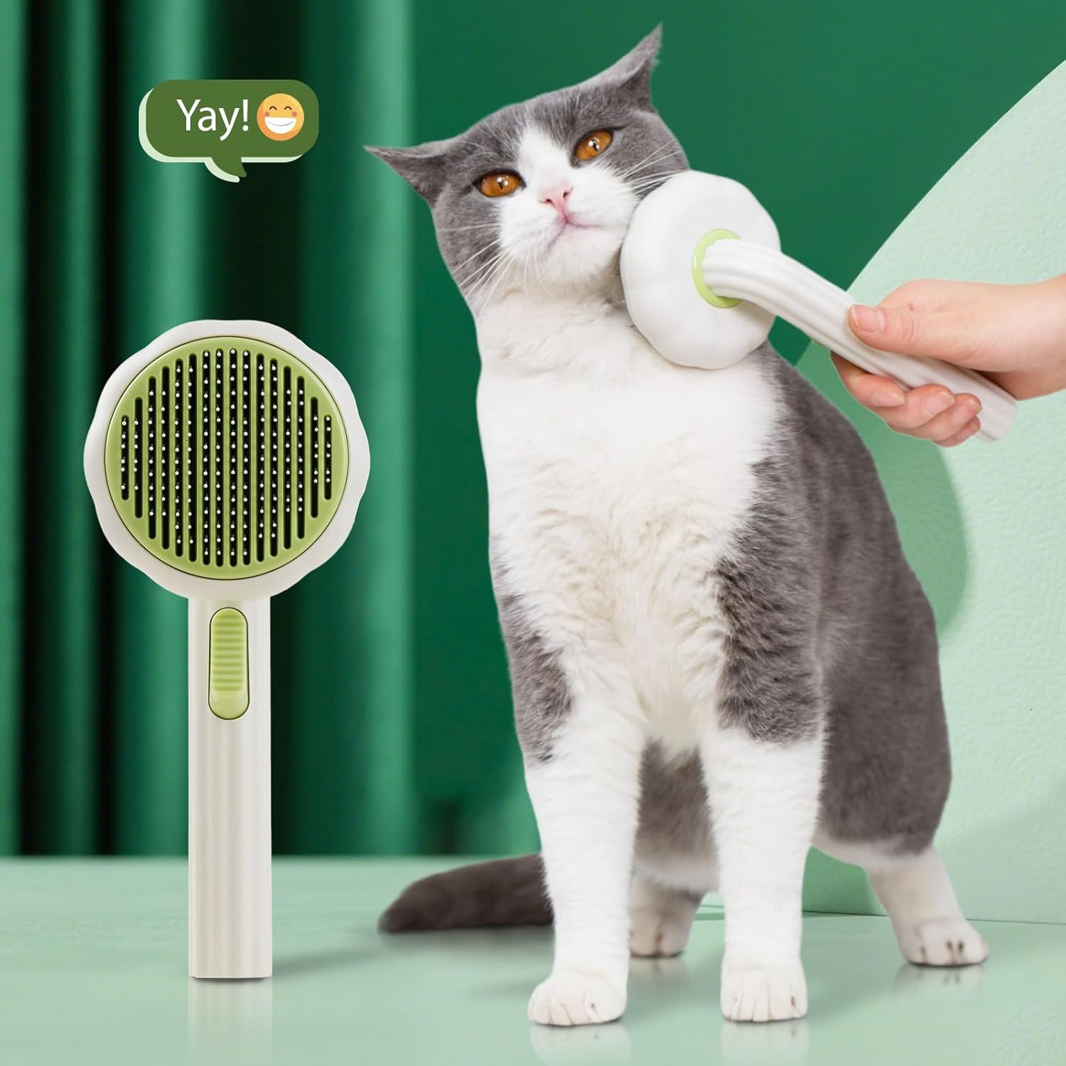 VIOJOJO cat brush with release button showing the one click hair removal mechanism in action.