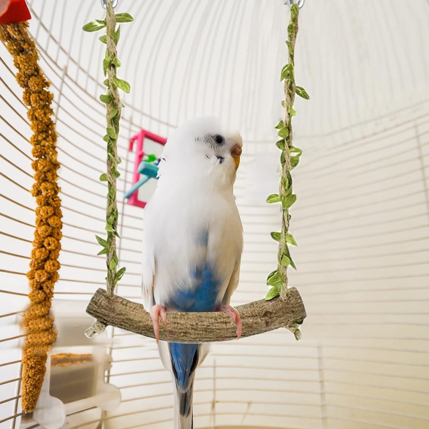 Hanging bird swing with decorative leaves showing stable perch holder