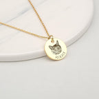 Person wearing Anavia engraved pet portrait disc necklace