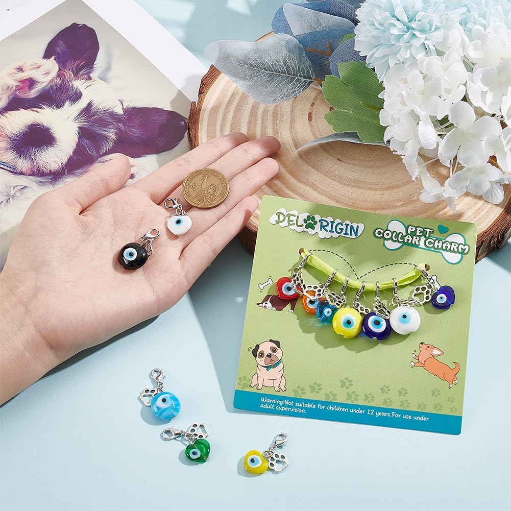 Multi colored lucky dog paw print pet collar pendants laid out flat to demonstrate the various styling options.