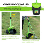 Coated metal rake gathering pet waste on a grass lawn yard surface.
