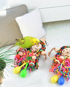 Parakeet playing with Bissap natural shredding bird toy