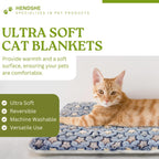 Two pack of reversible pet mats for indoor cats displayed on a living room sofa.