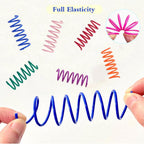 Indoor cat batting an interactive pink plastic coil spring toy during independent self play.