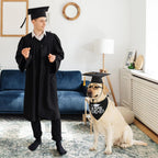 Medium size dog posing for graduation photo session in full outfit