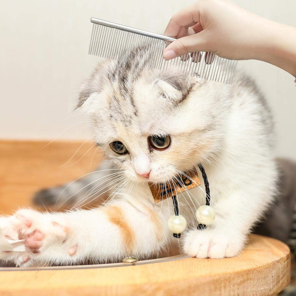 Azwood stainless steel cat grooming tool showing the wide needle side designed for lifting loose undercoat fur.