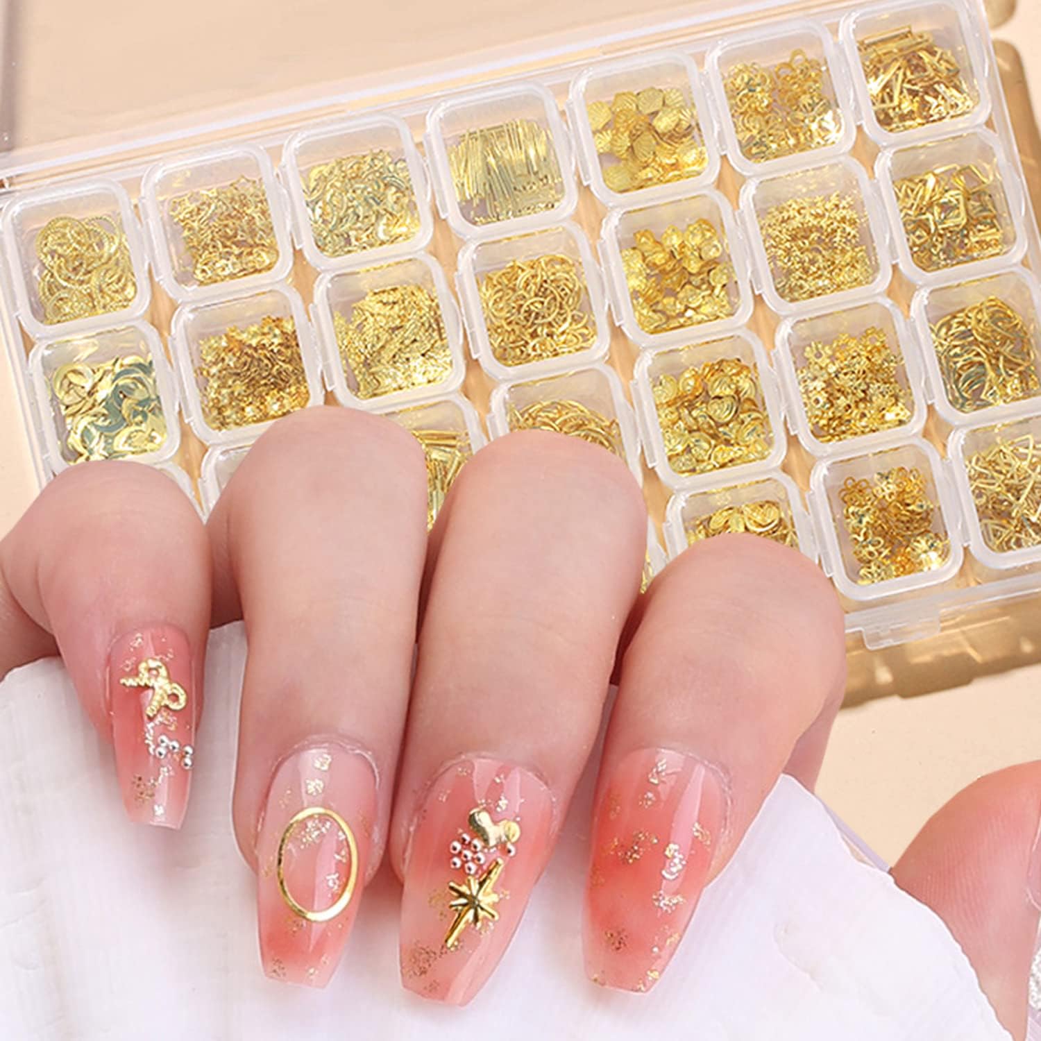 Vezocim 28 Grids Gold Metal Nail Studs container front view showing multiple geometric shapes.