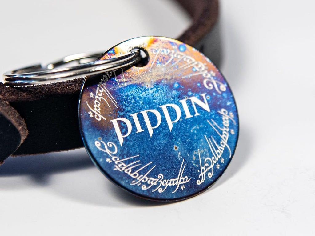 Custom Elvish inspired stainless steel dog identity tag with blue purple iridescent finish.