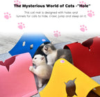 Kitten playing with the attached hanging plush ball inside the interactive structure.