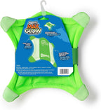 Chuckit! glow in the dark dog toy being thrown outdoors