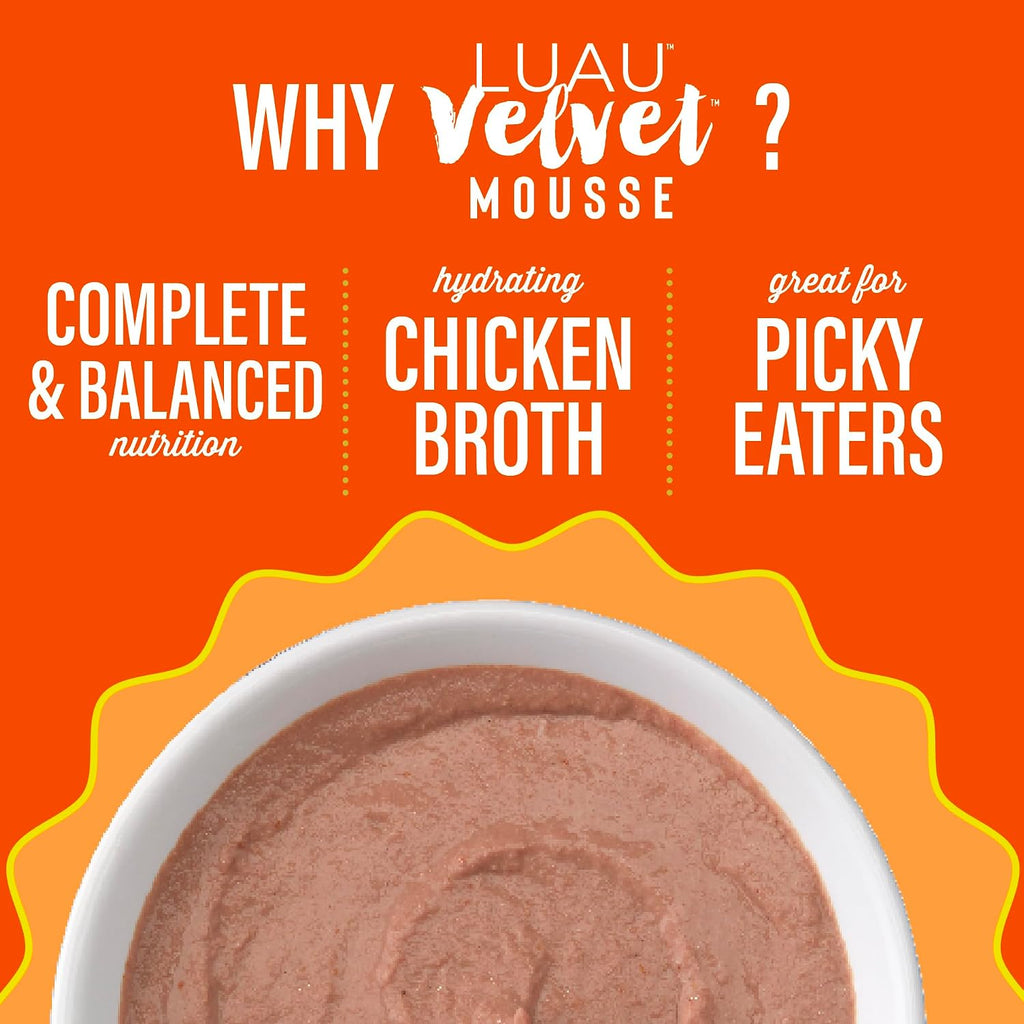 Happy cat enjoying Tiki Pets velvet mousse meal