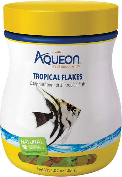 Aqueon Tropical Flakes container held in hand for scale