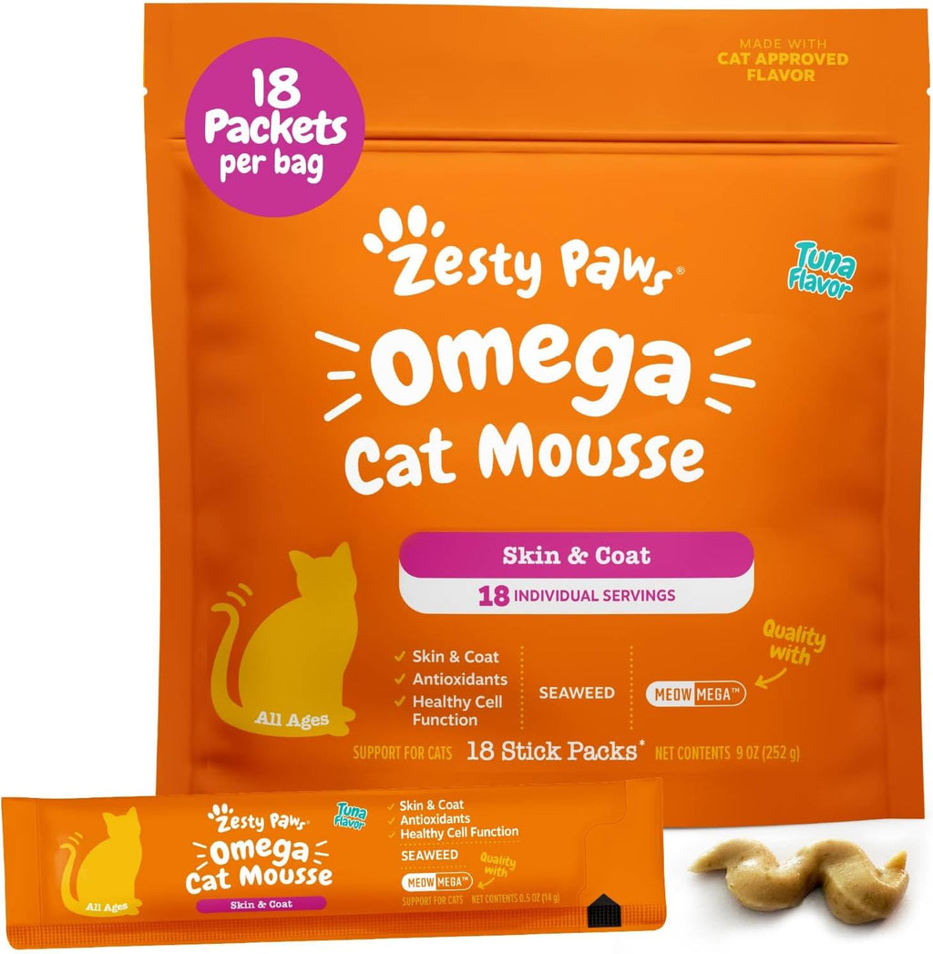 Cat enjoying Zesty Paws Omega Cat Mousse treat