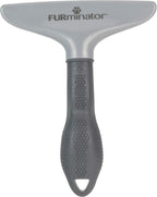 FURminator grooming rake removing loose pet hair