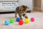 Assorted color vented plastic lattice cat rattle balls displayed on a flat surface.
