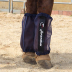 Lime green mesh fly boots preventing horsefly bites in the pasture
