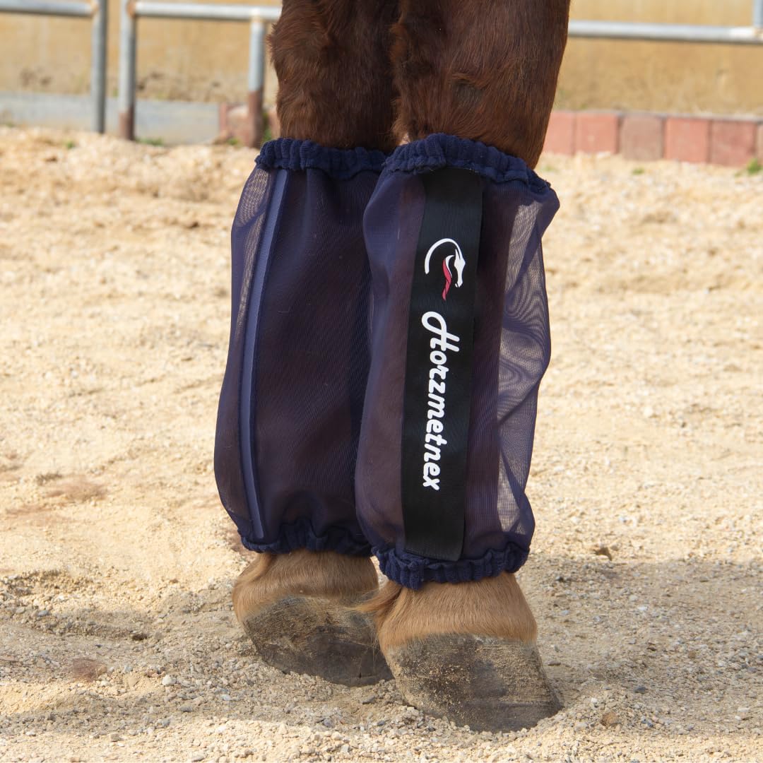 Lime green mesh fly boots preventing horsefly bites in the pasture