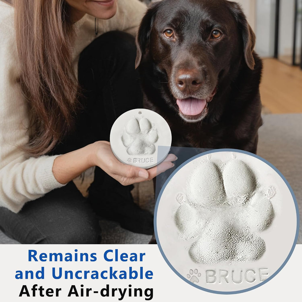 Two round and one heart shaped MYPAWLETS clay keepsakes displayed on plastic stands.