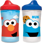 NUK Sesame Street Hard Spout Sippy Cup front view showing red lid and character graphics.