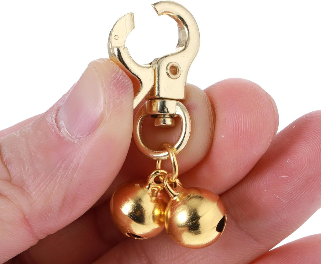 Heavy duty pet training bells attached securely to a standard dog collar D-ring.