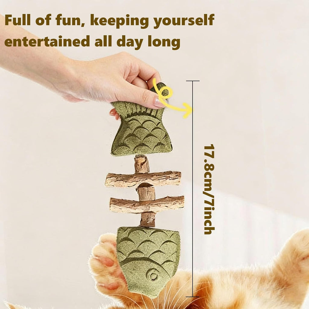 Indoor cat playing with green zhenyan fishbone shaped catnip chew toy